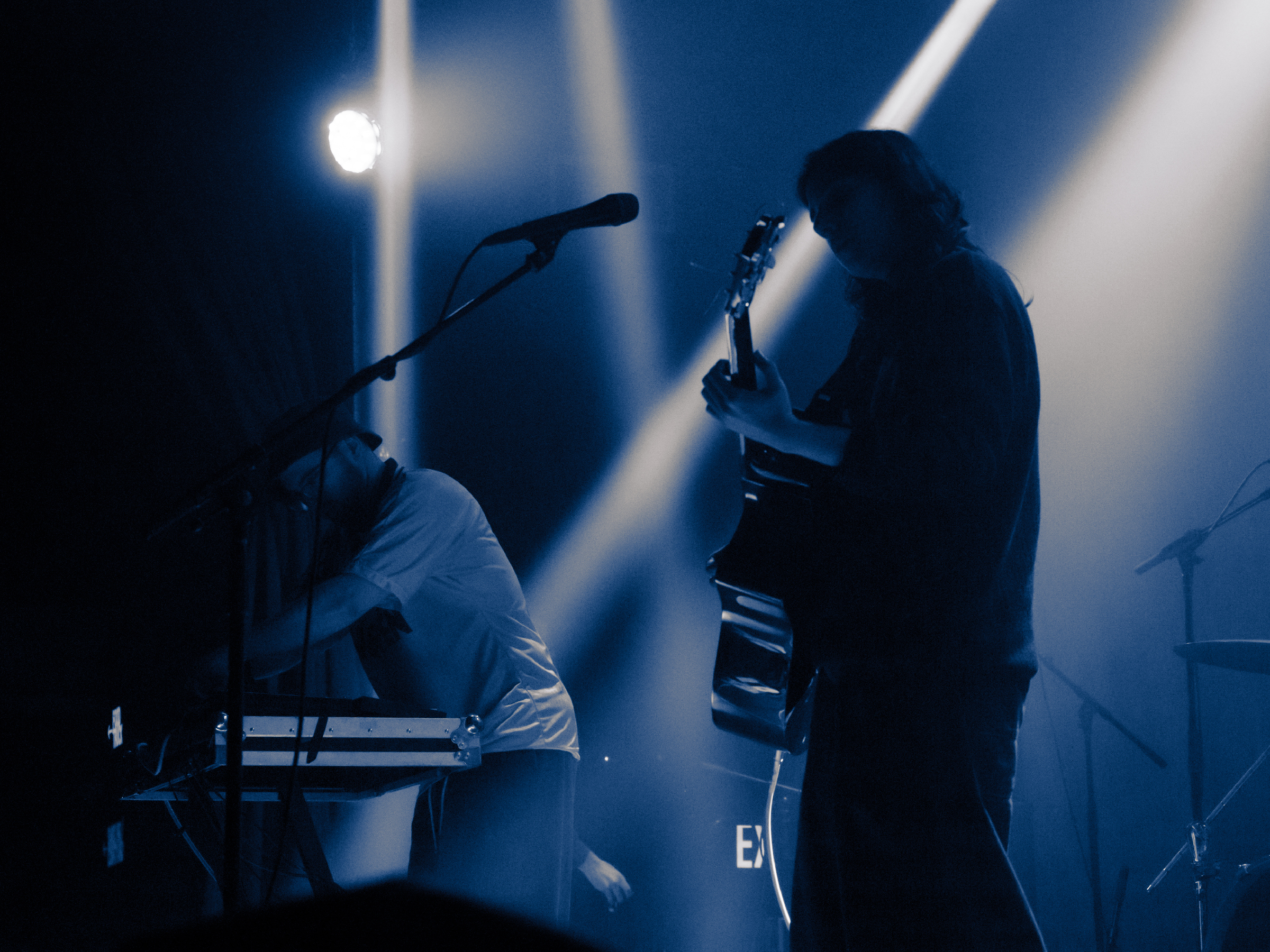 Nara, silhouetted in the foreground; Will lit in the background.