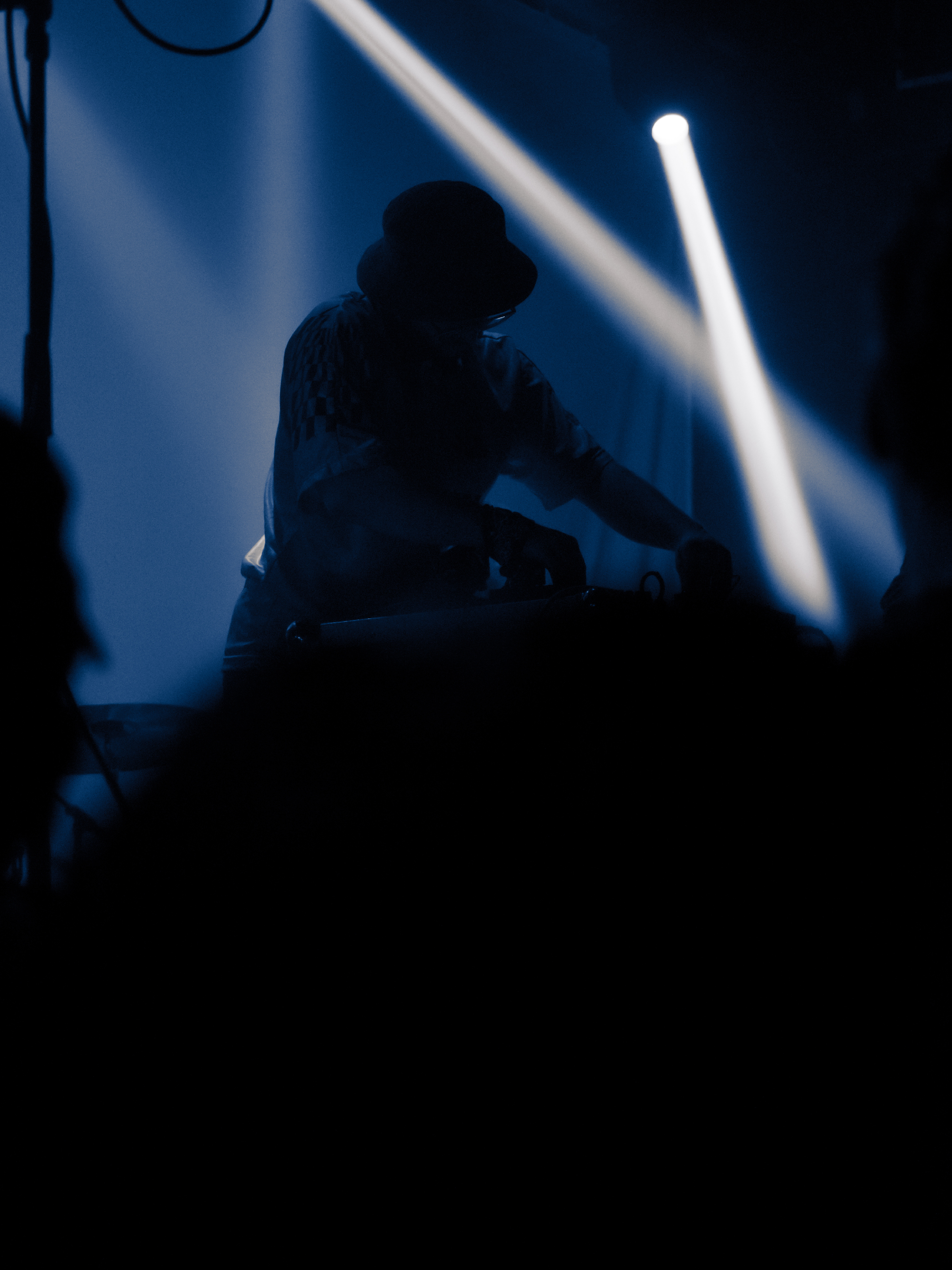 Will is silhouetted, playing with his noise-board.