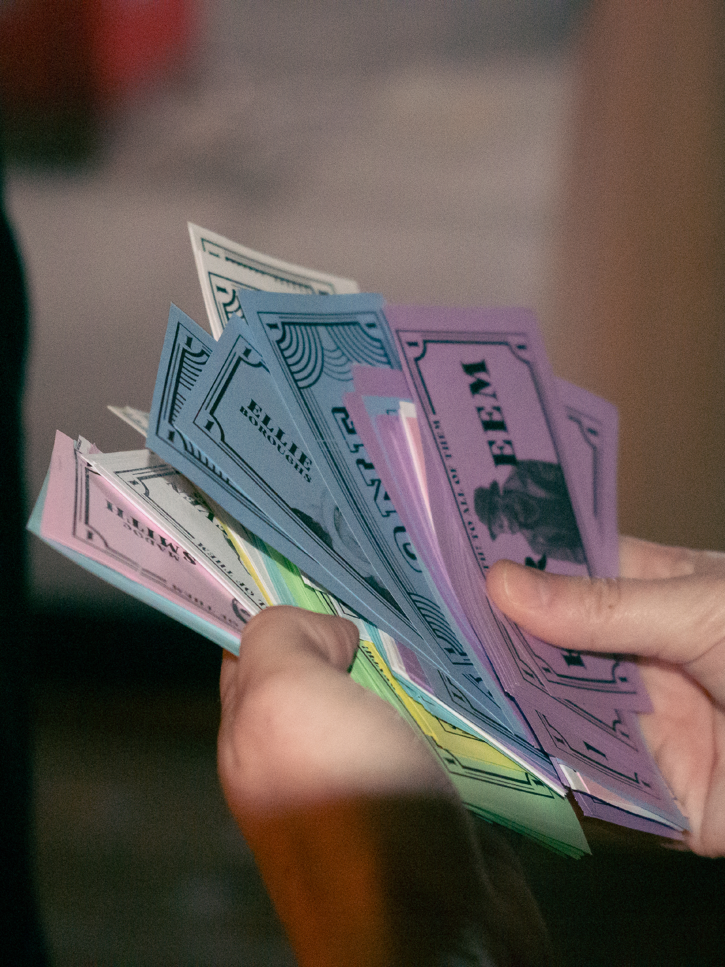 Prop money is fanned out to show camera.