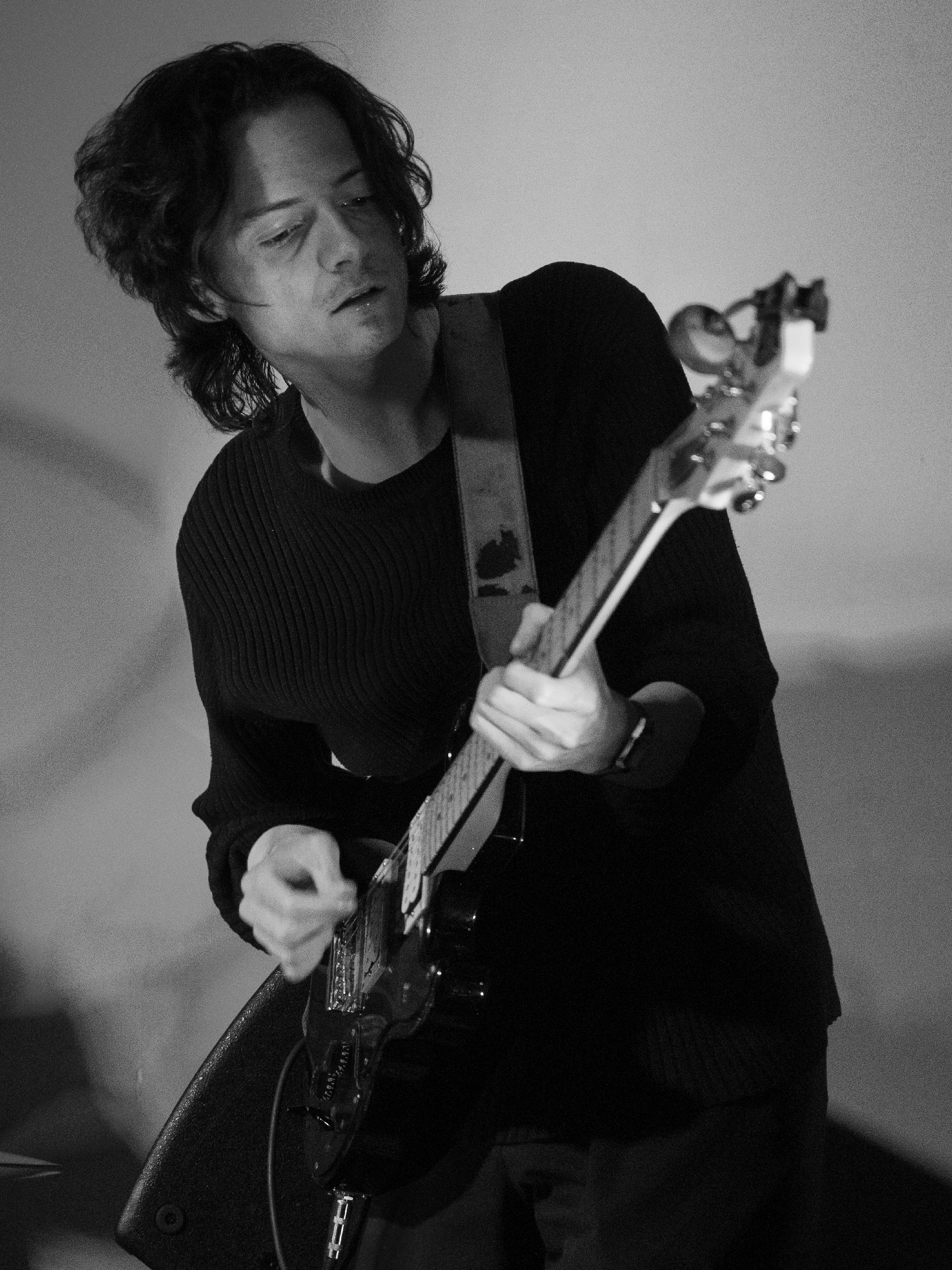 Portrait of Ben playing guitar.