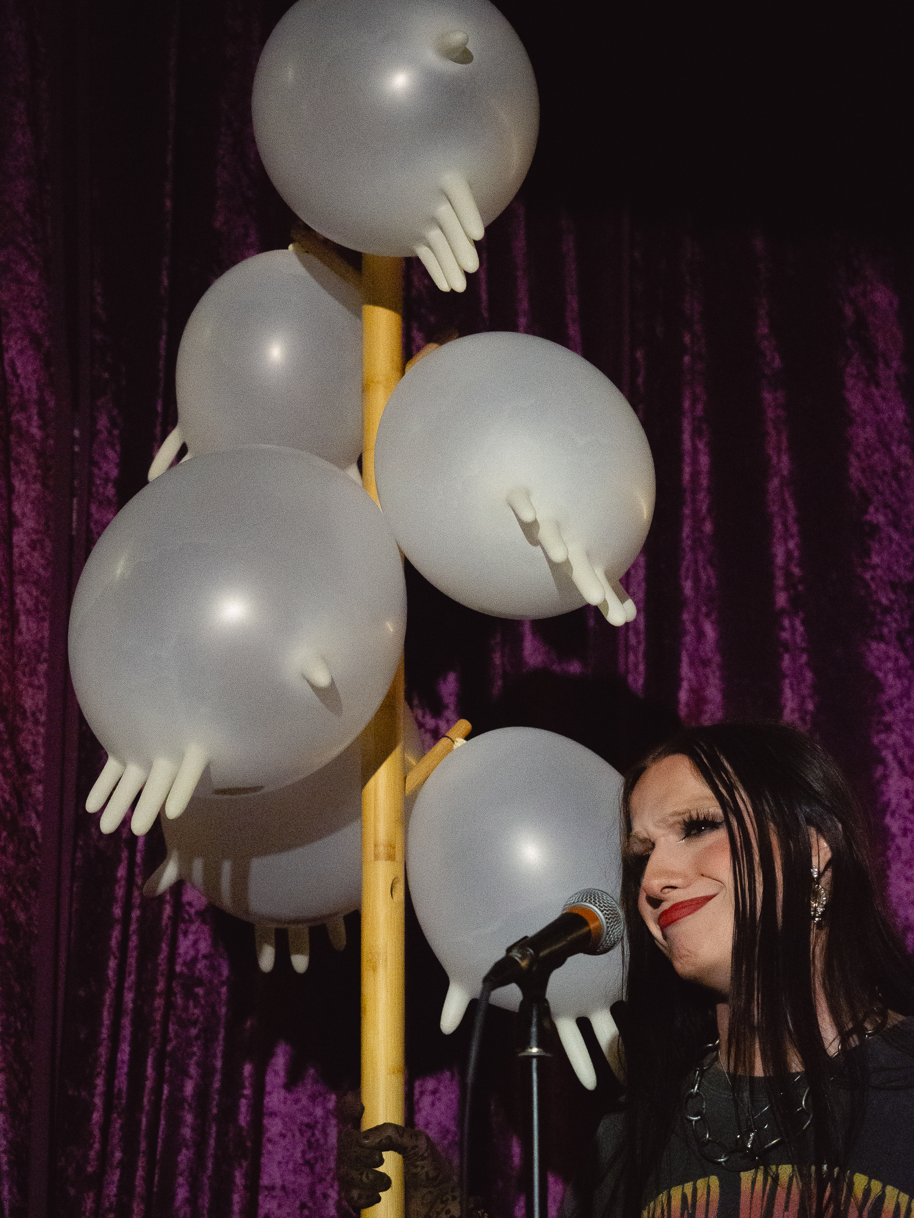 Tina Hand beneath tower of hands.