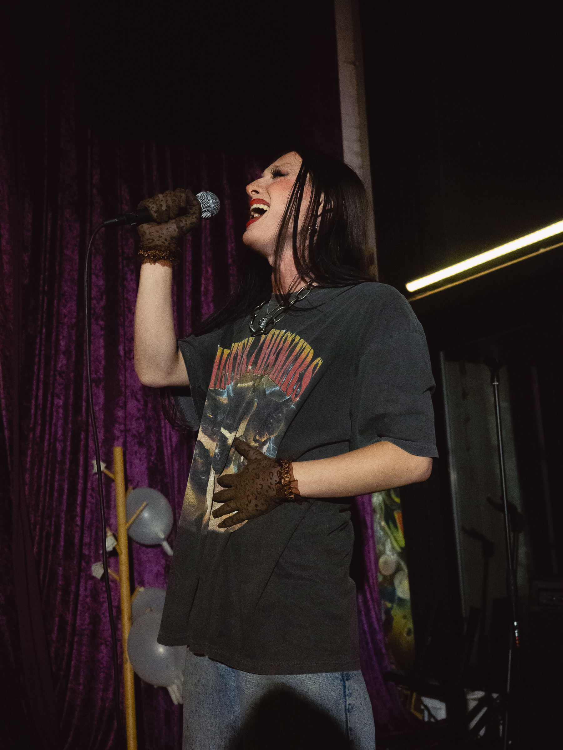 Tina Hand sings a number.