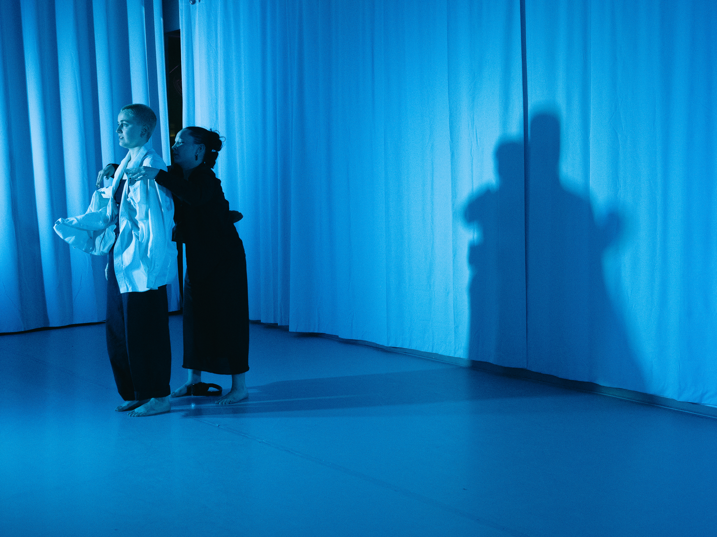 Photo of dancers performing A Dreamt up Draft of Suggestion.